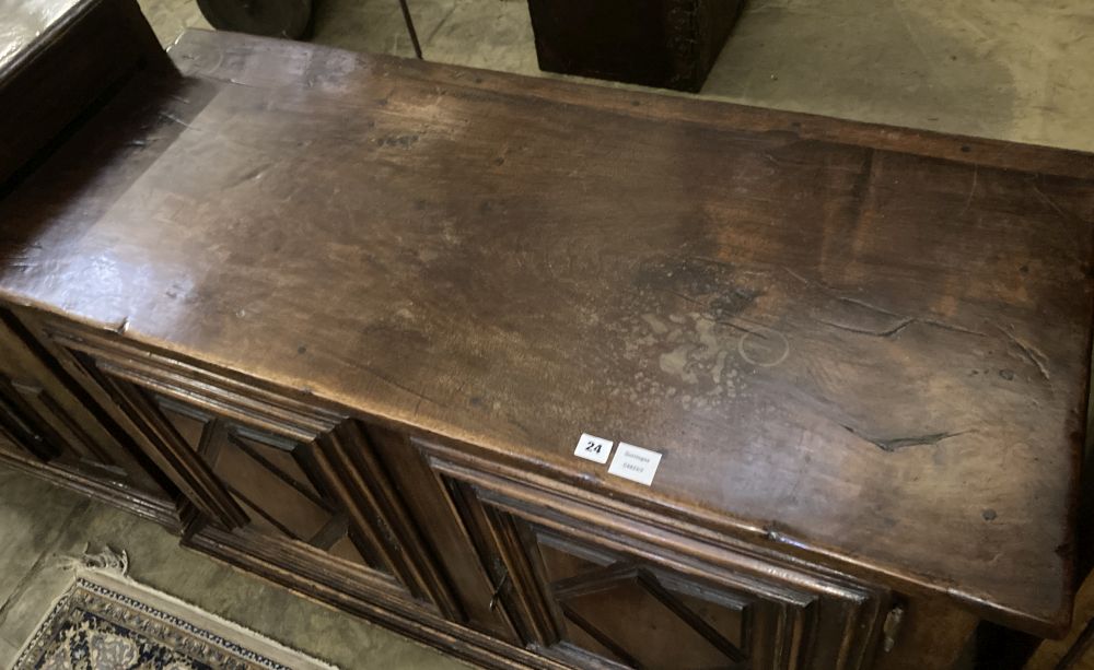 A mid 18th century French provincial oak and elm two door cupboard, with fruitwood top, width 129cm, depth 54cm, height 87cm